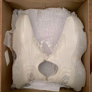 Steven madden women’s shoe with rhinestones on the Heel of the shoe.